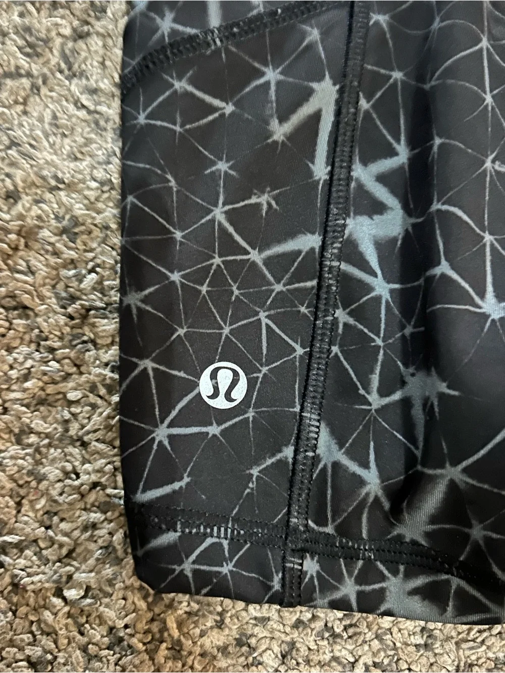 Lululemon What The Sport shorts in a black and grey geometric pattern 4”